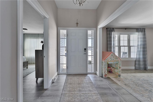 foyer entrance with hardwood / wood-style floors