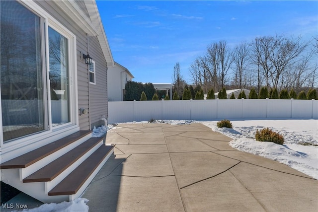 view of snow covered patio