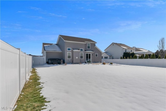 view of snow covered house