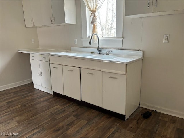 kitchen with white cabinetry and dark hardwood / wood-style flooring