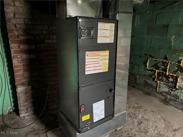 utility room with heating unit