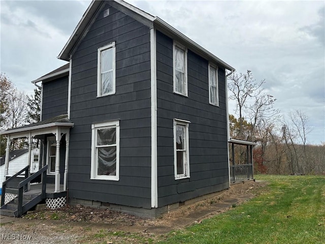 view of home's exterior featuring a yard