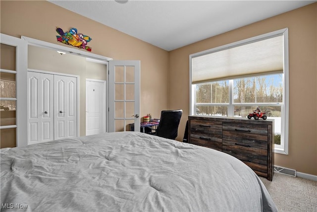 bedroom featuring carpet and lofted ceiling