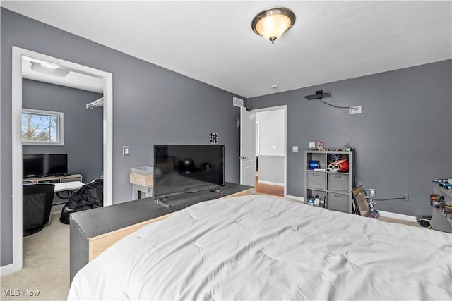 bedroom featuring light colored carpet