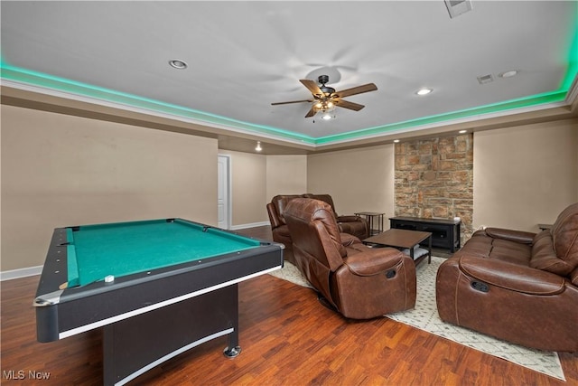 playroom with hardwood / wood-style flooring, billiards, a raised ceiling, and ceiling fan