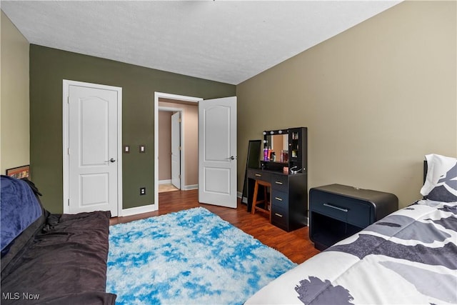 bedroom featuring dark hardwood / wood-style floors