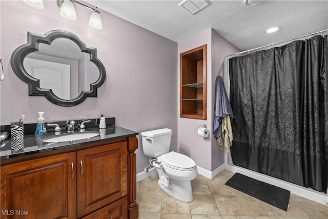 bathroom featuring vanity, toilet, tile patterned floors, a textured ceiling, and a shower with shower curtain