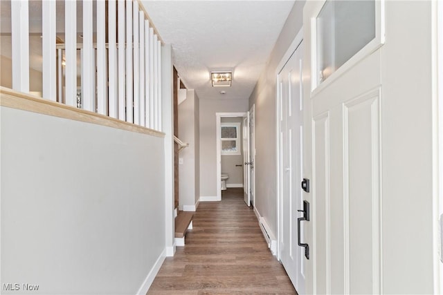 hall with wood-type flooring