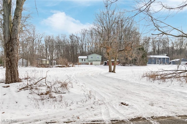 view of yard layered in snow