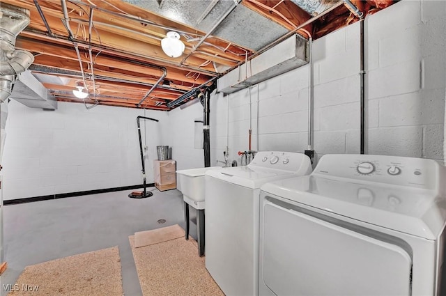 clothes washing area with separate washer and dryer