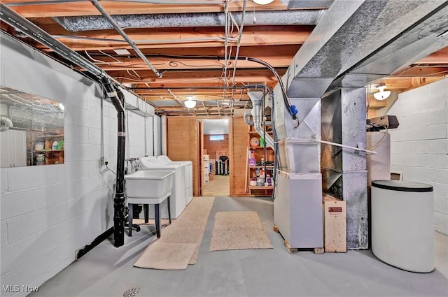 basement with independent washer and dryer and sink