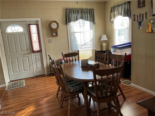 dining room with hardwood / wood-style floors