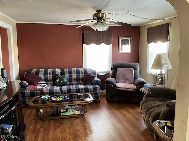 living room featuring crown molding, hardwood / wood-style floors, and ceiling fan