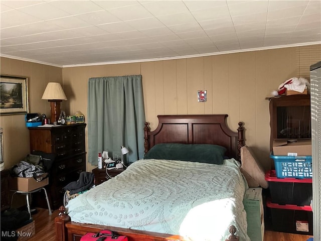 bedroom with hardwood / wood-style flooring