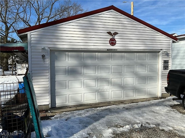 view of snow covered garage