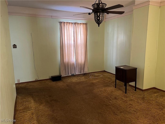 unfurnished room with dark carpet and ceiling fan