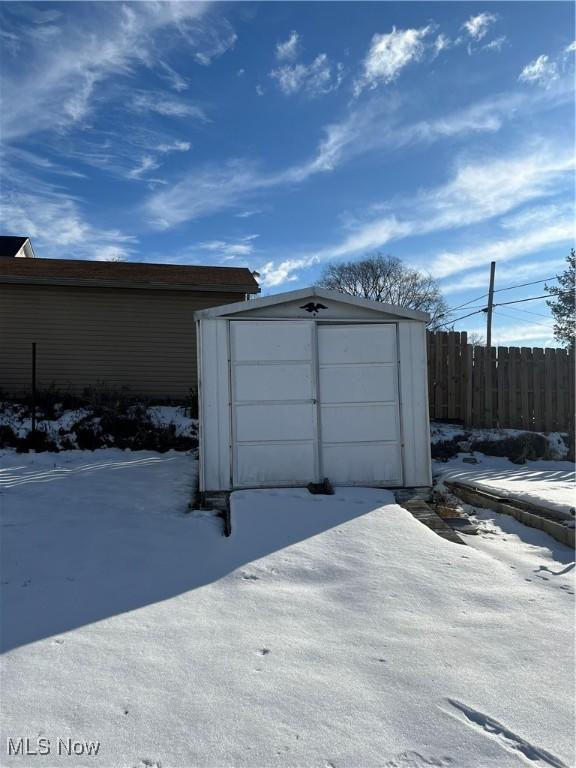 view of snow covered garage