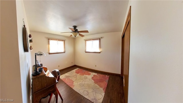 interior space featuring ceiling fan and dark hardwood / wood-style flooring