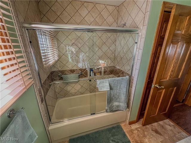 bathroom featuring enclosed tub / shower combo