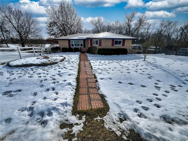 view of yard layered in snow