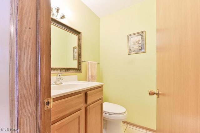 bathroom with vanity, tile patterned floors, and toilet