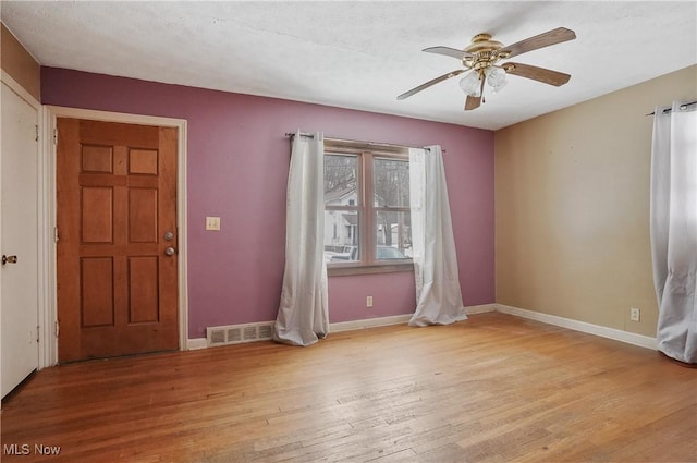 foyer featuring ceiling fan and light wood-type flooring