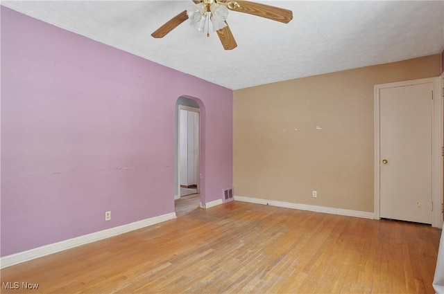 unfurnished room featuring ceiling fan and light wood-type flooring