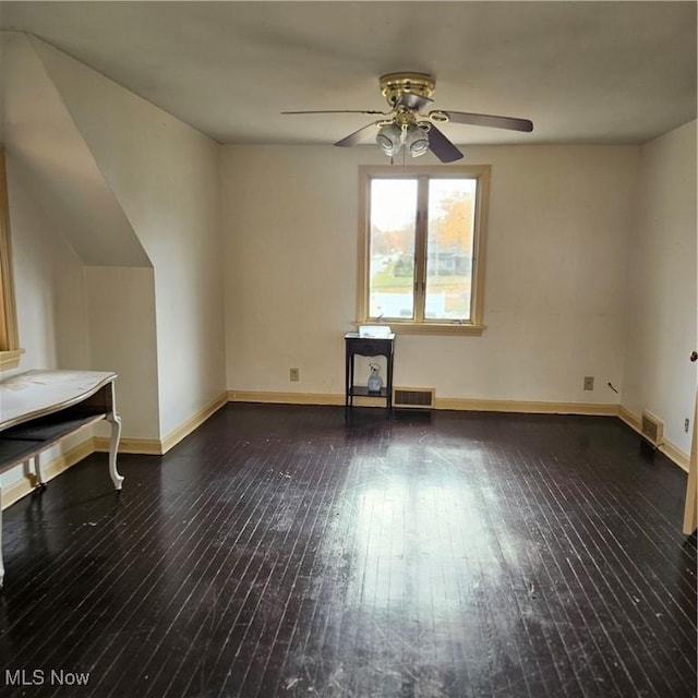 interior space with dark hardwood / wood-style floors and ceiling fan