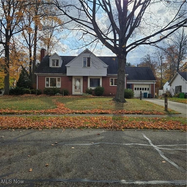 view of front of home with a garage and a front yard