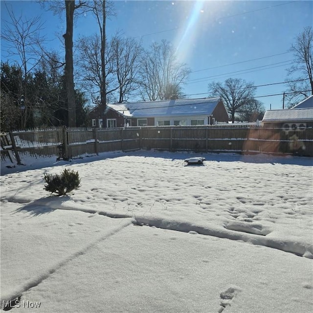 view of yard layered in snow