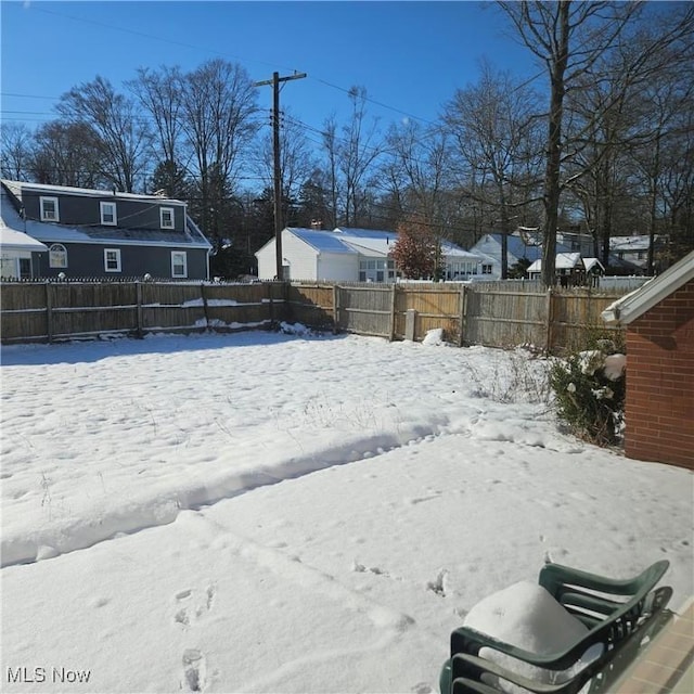 view of yard covered in snow