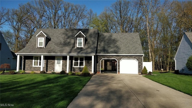 cape cod-style house featuring a garage and a front yard