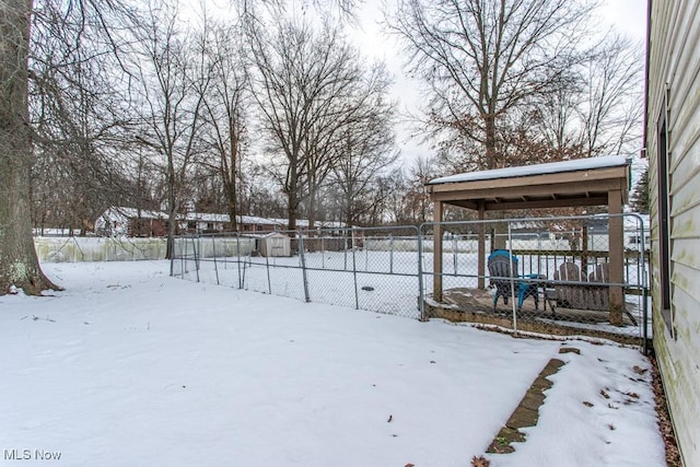 view of yard layered in snow