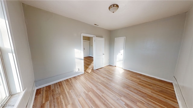 empty room featuring light hardwood / wood-style floors