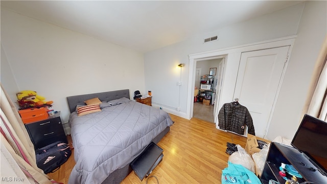 bedroom with light wood-type flooring