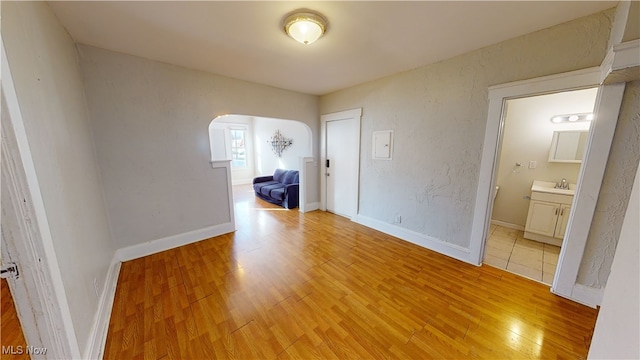 interior space with sink and light wood-type flooring