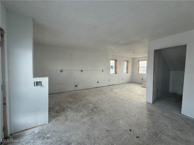 empty room with a textured ceiling