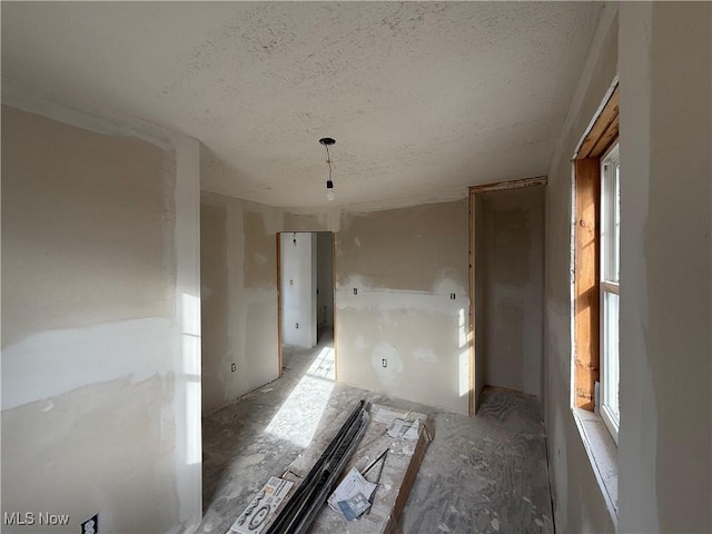 interior space featuring a textured ceiling