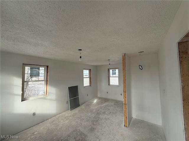 empty room with a textured ceiling