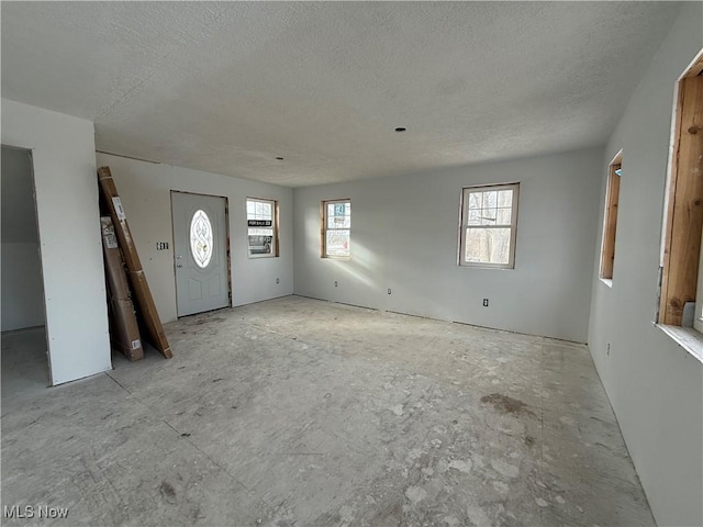 foyer with a textured ceiling