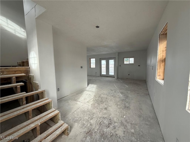 unfurnished living room with french doors