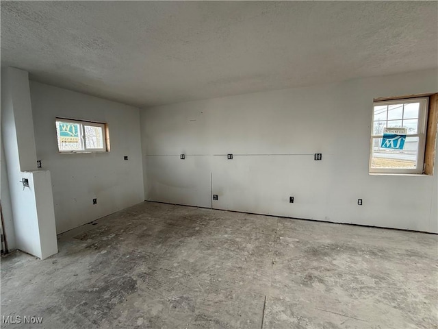 spare room featuring a textured ceiling