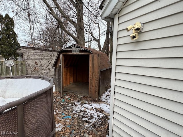 exterior space with a shed