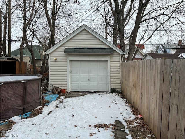 view of snow covered garage