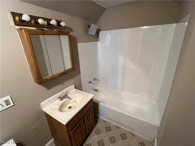 bathroom with vanity and  shower combination