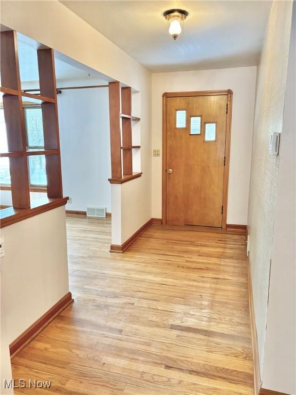 foyer with light hardwood / wood-style floors