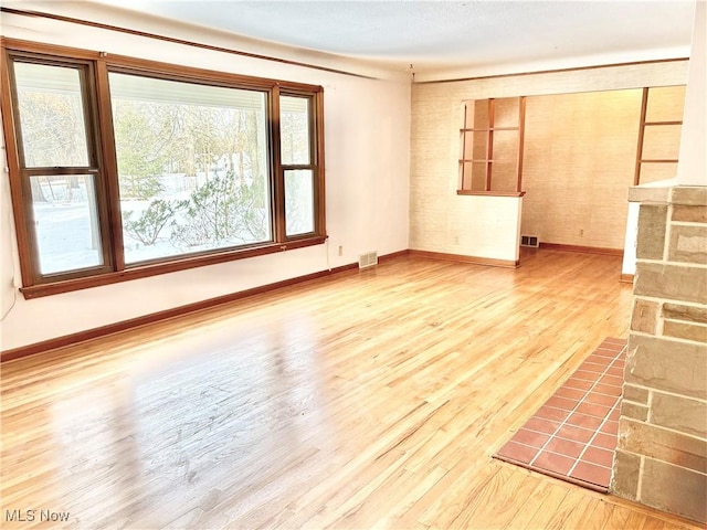 spare room featuring light hardwood / wood-style flooring