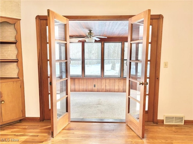 entryway with light hardwood / wood-style flooring, french doors, and ceiling fan