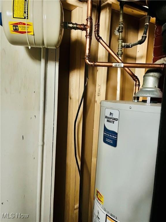 utility room with water heater