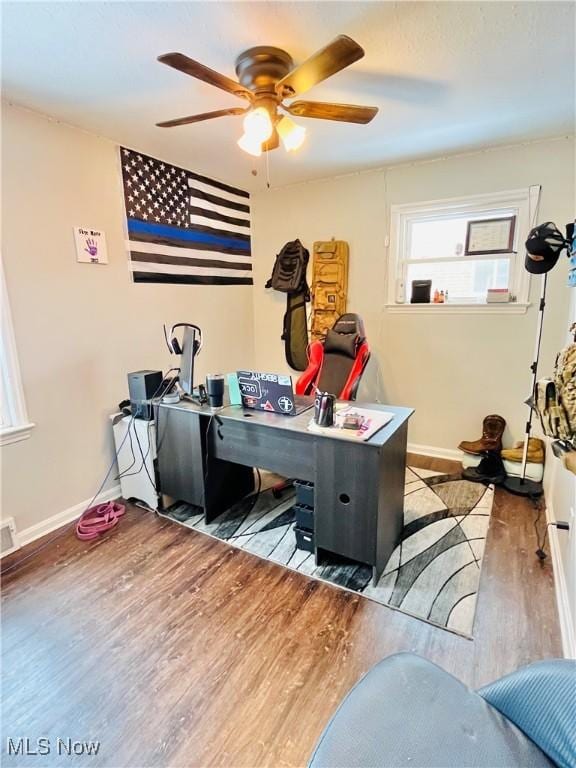 office area featuring dark hardwood / wood-style floors and ceiling fan